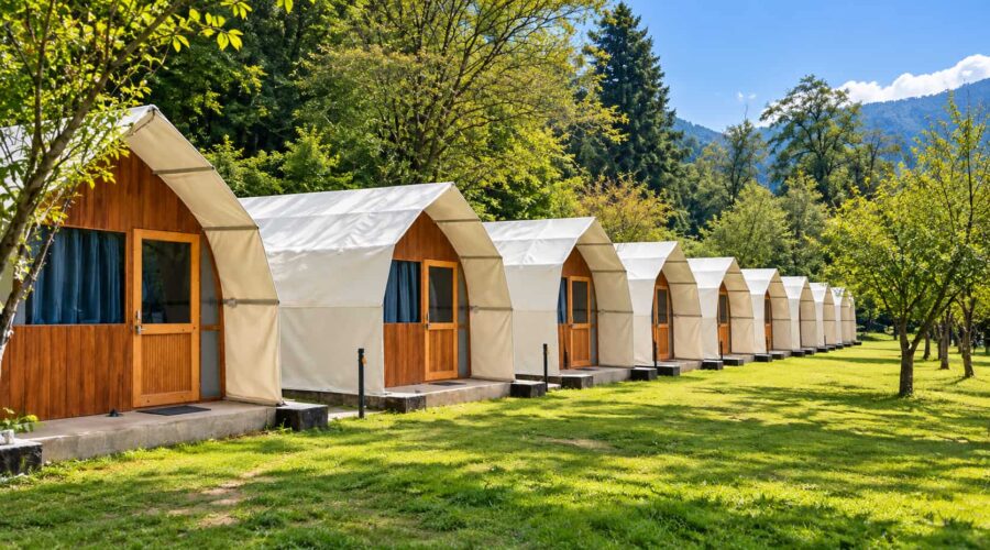 Into Wild Himalaya Camp Manali – Summer Tented Camp Into Wild Himalaya Camp Manali tents surrounded by green Himalayan landscape