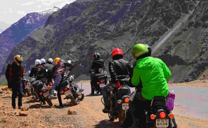 Riders Taking a Break on Manali–Leh Highway Group of bikers stopped on motorcycles discussing route on the Manali to Leh Highway, Himalayas