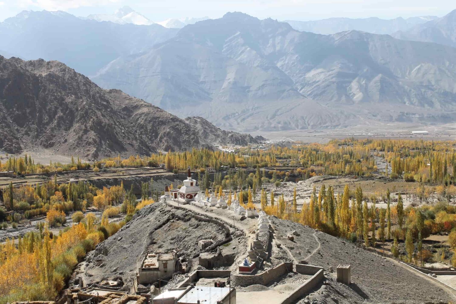 High-altitude trekking camp under snow peaks on Zanskar Valley Trek, Padum–Darcha route, Himalayas India.