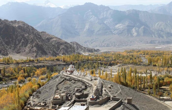 High-altitude trekking camp under snow peaks on Zanskar Valley Trek, Padum–Darcha route, Himalayas India.