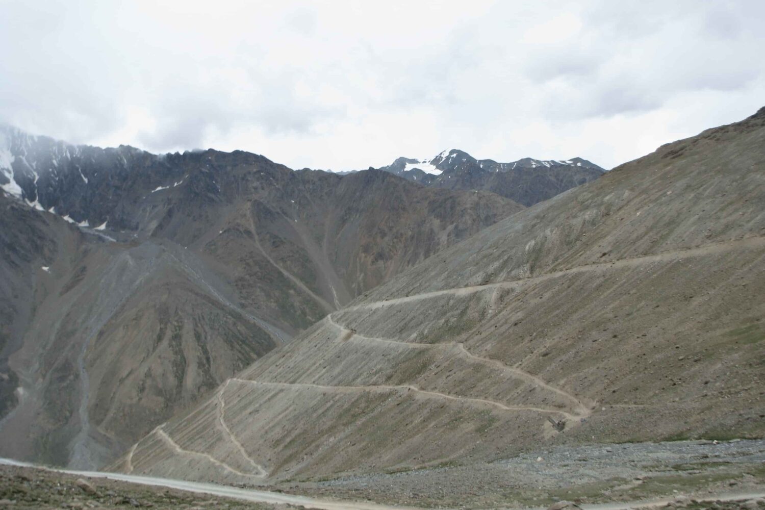 Loop bends below Kunzum La Pass in Spiti Valley on the route of the Royal Enfield Motorcycle Tour with Into Wild Himalaya