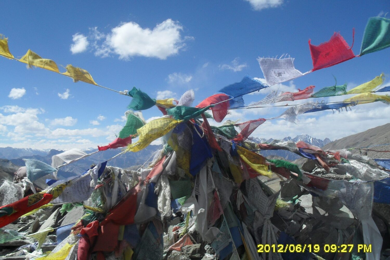 Panoramic view of Markha Valley with winding river, green pastures, and barren Ladakhi mountains under a clear blue sky