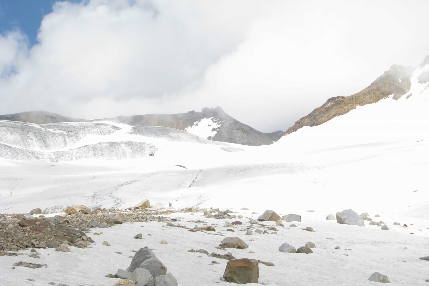 Glacier-covered high mountain pass at Pin Parvati Pass Trek in the Himalayas with snow and rugged terrain.