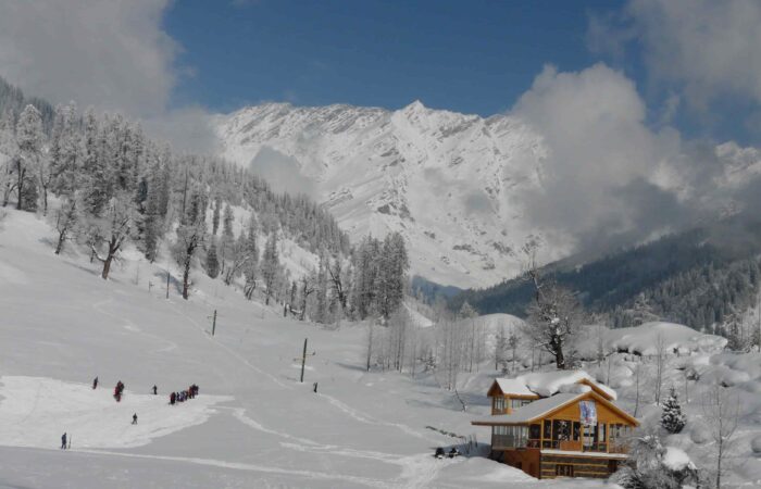 Winter trek and skiing in Manali with snow, mountains and guided Himalayan adventure experience.