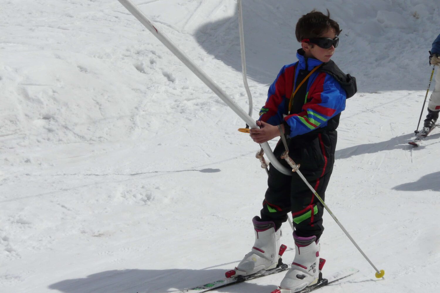Skier gliding through fresh snow in Manali, Indian Himalayas during winter adventure training