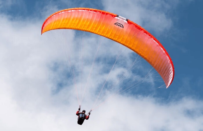 Student learning canopy inflation technique during beginners paragliding training in Manali, Himachal Pradesh.