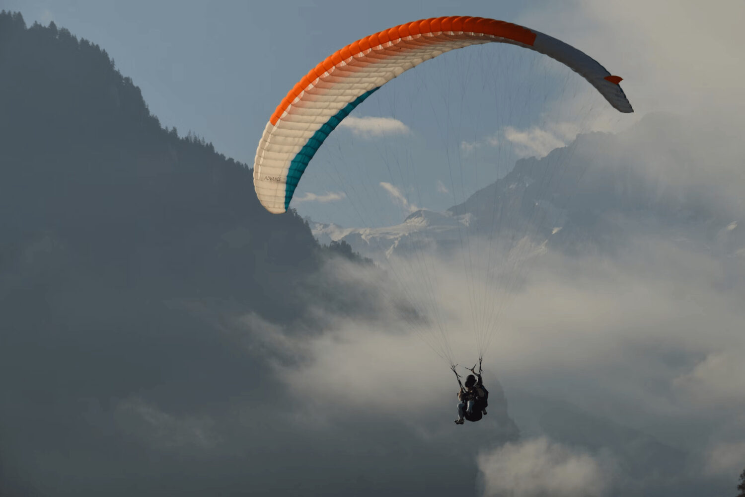 Student paraglider flying solo above Beas Valley during the beginners paragliding training course in Manali, Himachal Pradesh.